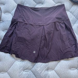 Lululemon High waisted purple skirt with shorts and pockets.